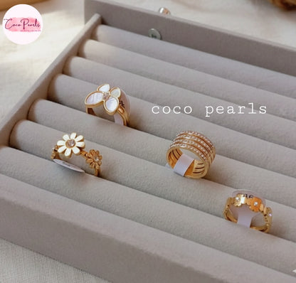 Coco Pearl stainless steel Anti tarnish  rings display on a beige mat