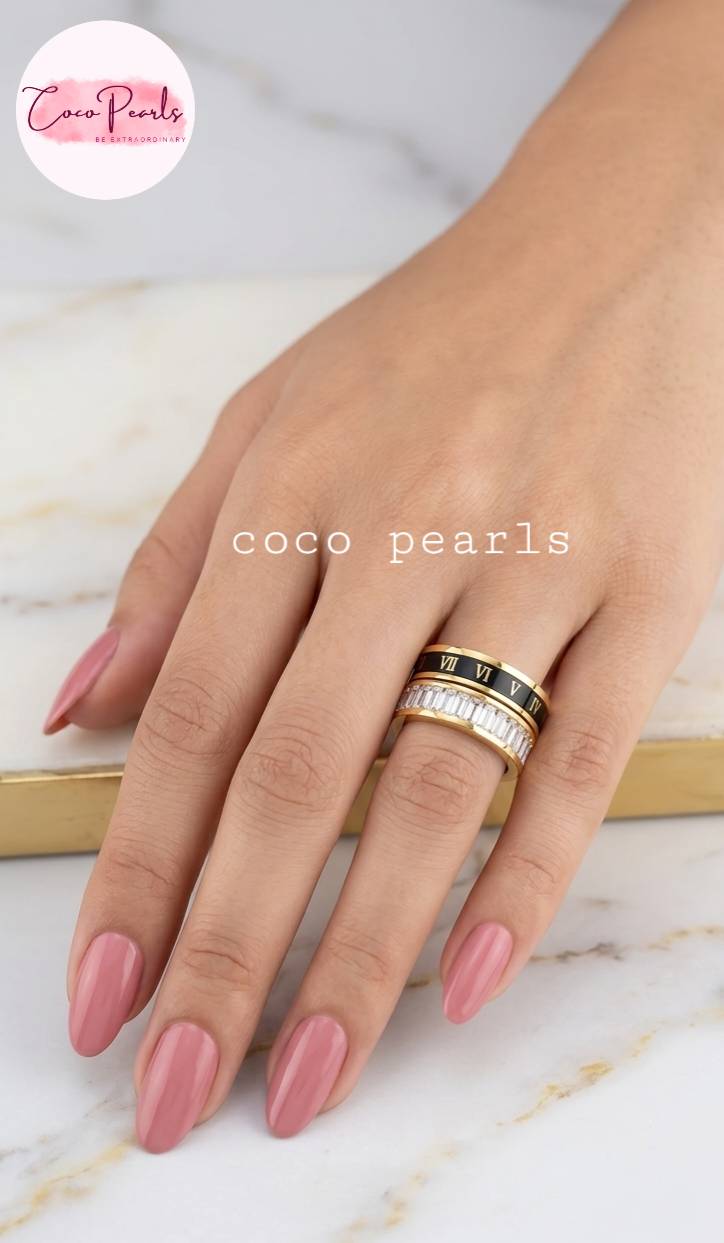 Coco pearls stainless Steel anti tarnish Gold roman empire ring with black band featuring Roman numerals and clear stones on a finger