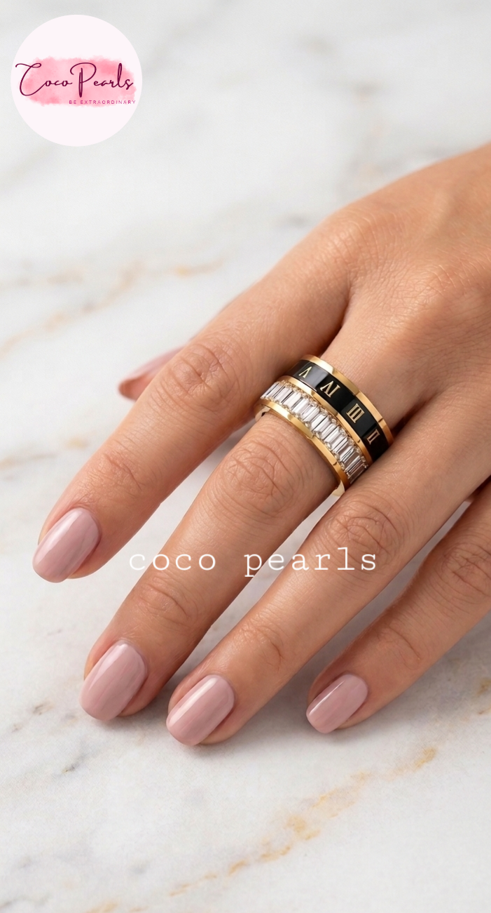 Coco pearls stainless Steel anti tarnish Gold roman empire ring with black band featuring Roman numerals and clear stones on hand