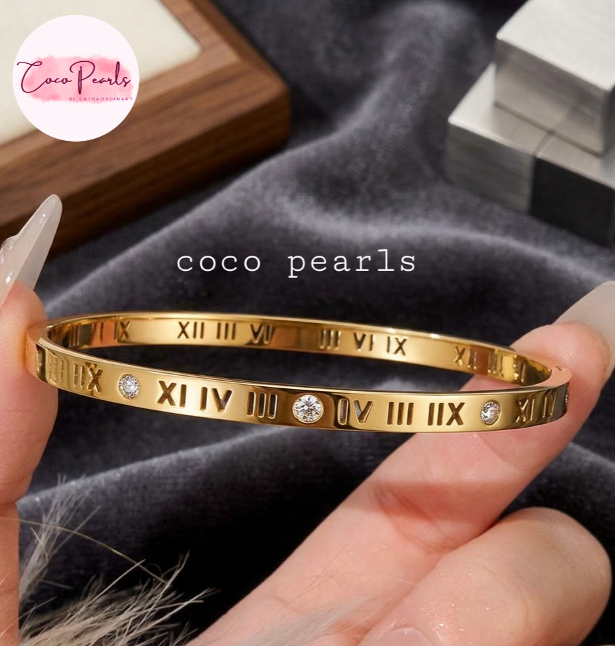Coco Pearls Stainless Steel Anti Tarnish Gold roman handcuff bangles with Roman numeral design on a hand