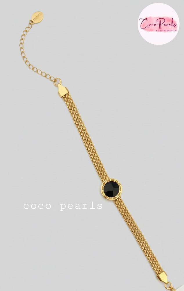 Coco Pearls Stainless steel Ani Tarnish Gold roman fake watch mesh bracelet with a black fake watch center on a white background