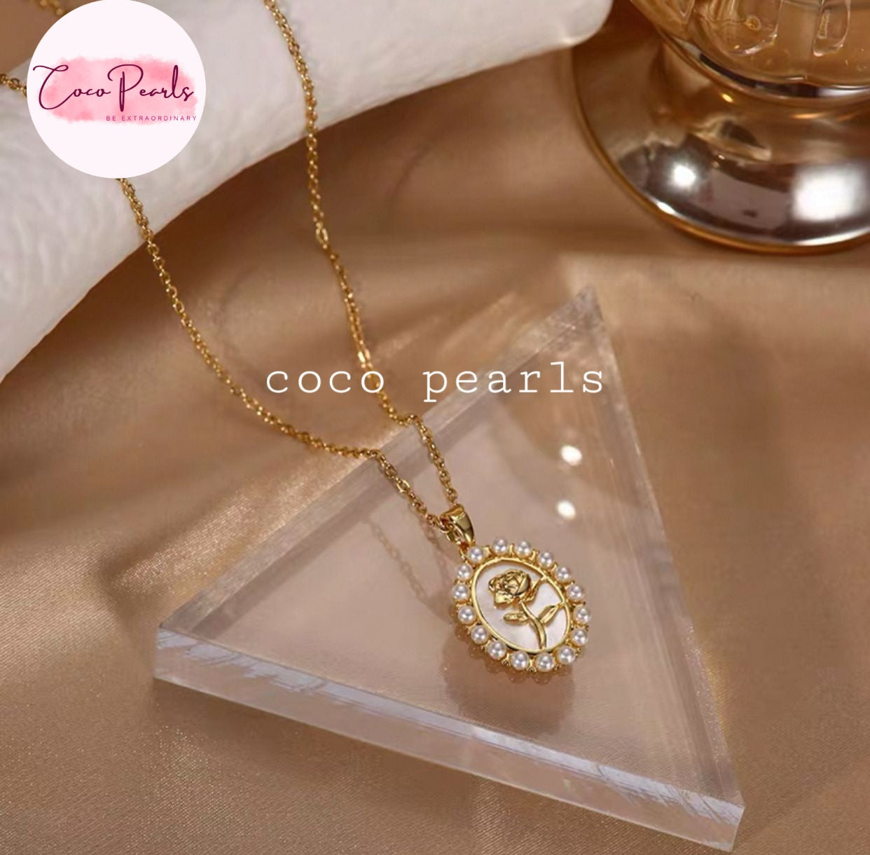 Coco Pearls stainless steel Anti tarnish gold rose pearl elegance necklace with gold rose and pearl outline on clear stand