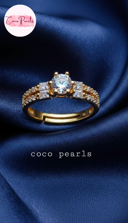coco pearls stainless steel anti tarnish gold royal  adjustable diamond studded ring displayed on blue satin