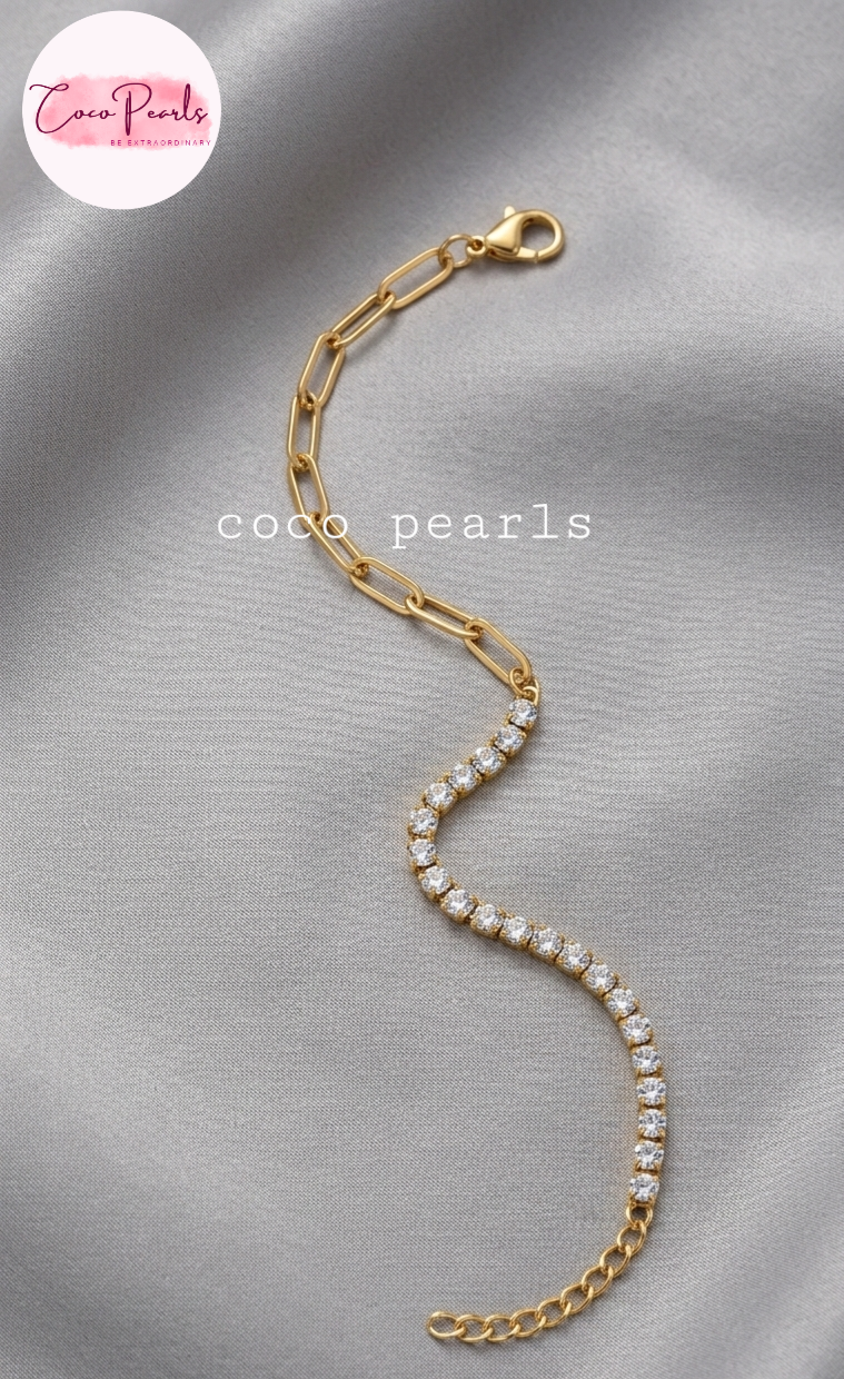 Coxo pearls stainless Steel anti tarnish Gold bracelet with clear stones on a light beige background
