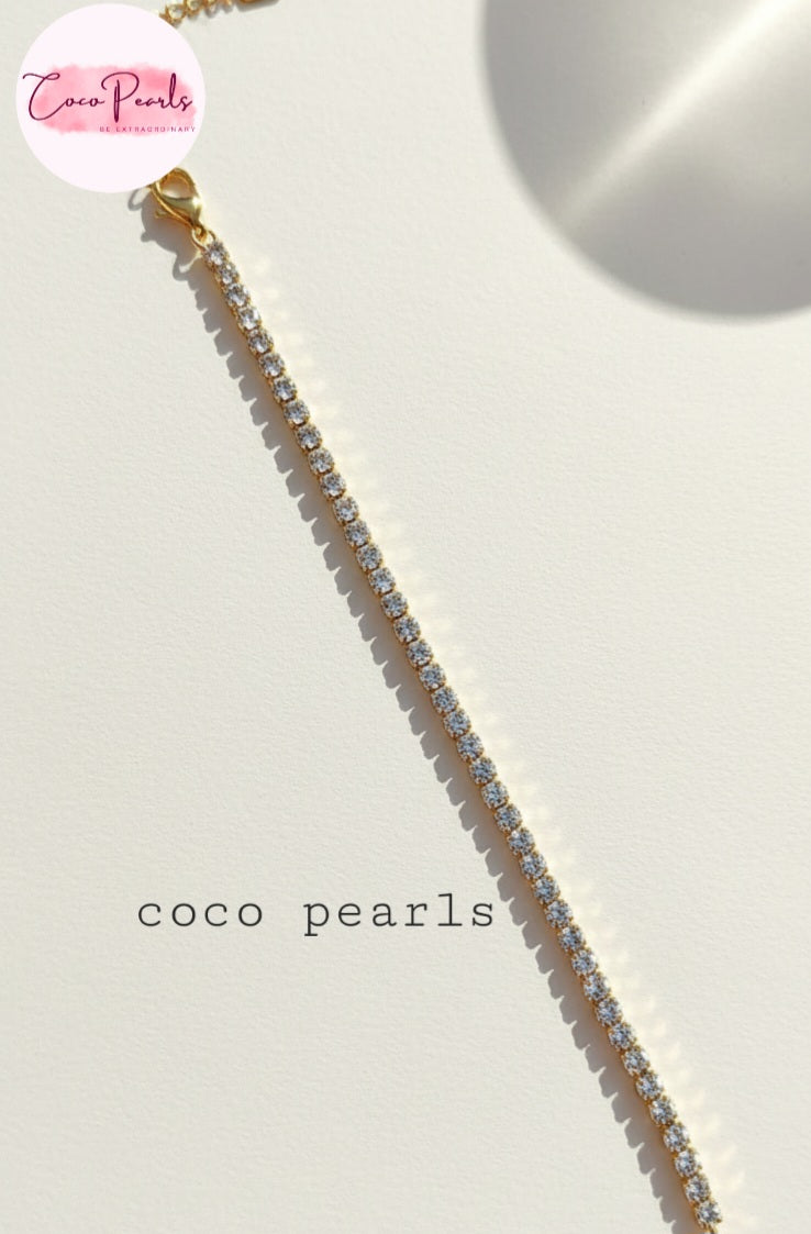 Coco Pearls Stainless Steel Anti Tarnish Gold sparkling delight bracelet clear stones on a white background