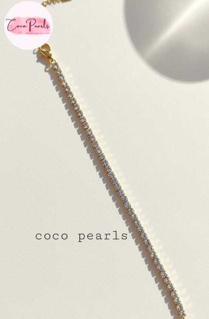 Coco Pearls Stainless Steel Anti Tarnish Gold sparkling delight bracelet clear stones on a white background
