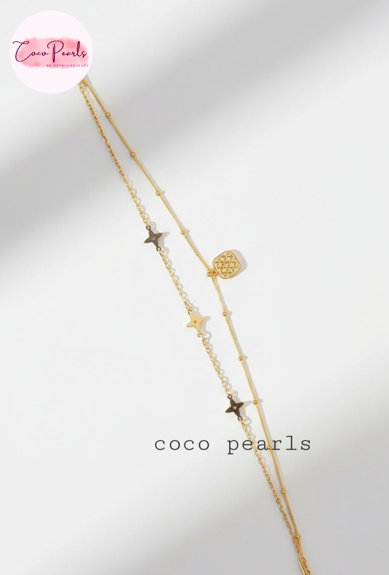 Coco Pearls Stainless steel Anti Tarnish Gold starry night anklet with star and heart pendants on a white background