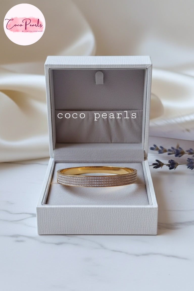 Coco Pearls Stainless Steel Anti tarnish gold stellar stack handcuff bangle bracelet displayed on jewelry box