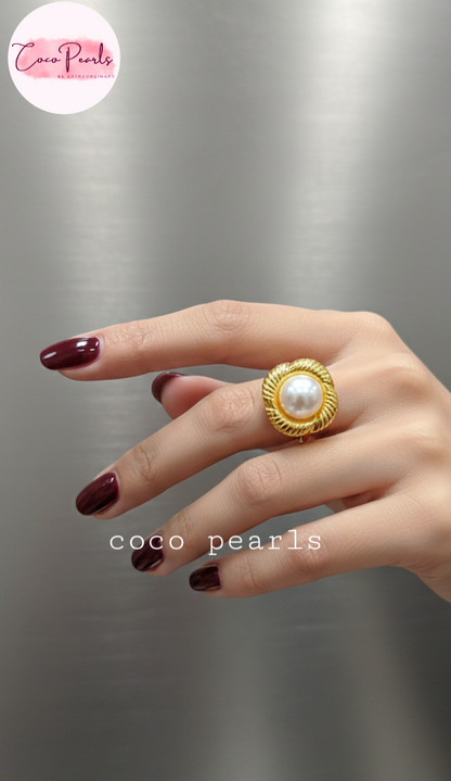 coco pearls stainless steel anti tarnish gold sun kissed pearl adjustable ring  with pearl in center of gold flower displayed on hand