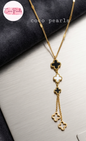 Coco Pearls Stainless Steel Anti Tarnish triple clover Gold necklace with clover designs. 2 black on white clover in middle with two gold clover hangings