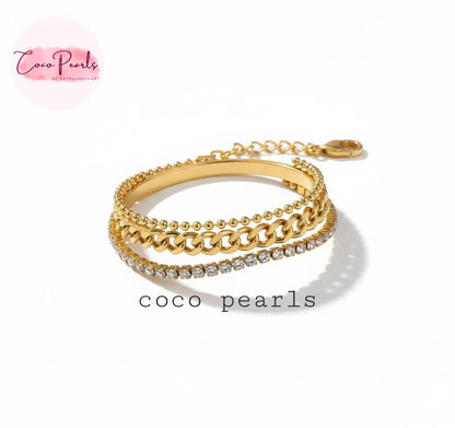 Coco Pearls Stainless Steel Anti Tarnish Gold triple threat glam bracelet with 3 layer bracelet. dot chain, thick chain and diamond accent stack displayed on white background