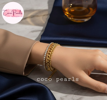hand wearing Coco Pearls Stainless Steel Anti Tarnish Gold triple threat glam bracelet with 3 layer stack bracelet. dot chain, thick chain and diamond chain