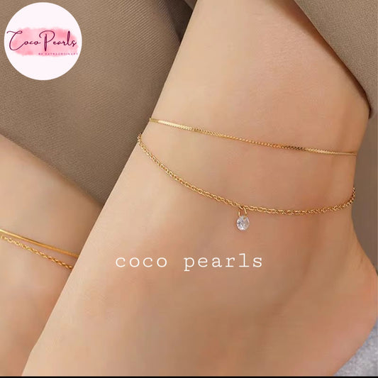 Coco Pearls Stainless Steel Anti Tarnish Gold twinkle duo anklet with double chain anklet with diamond on a person's ankle